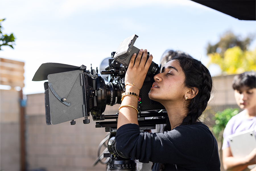 Student using a camera to shoot a film